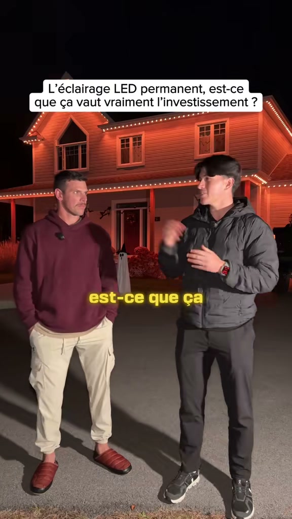 Deux hommes discutent devant une façade éclairée en rouge : est-ce vraiment un bon investissement